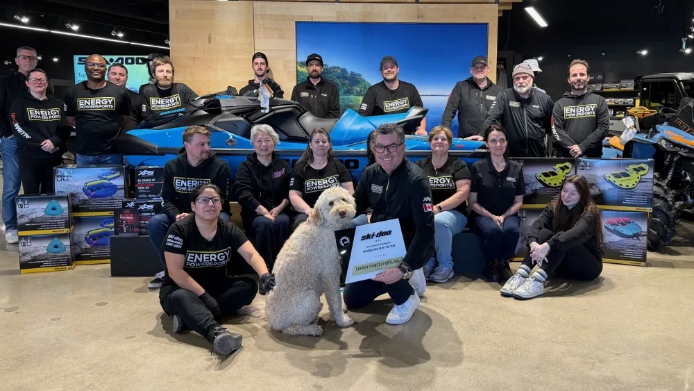 Energy Powersports staff inside the dealership showroom with BRP powersports products.