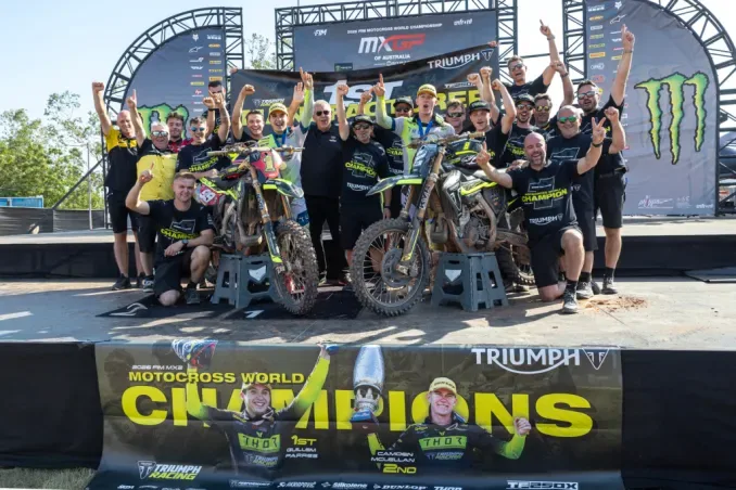 Triumph Factory Racing riders and motorcycles celebrating the 2026 MX2 world championship.