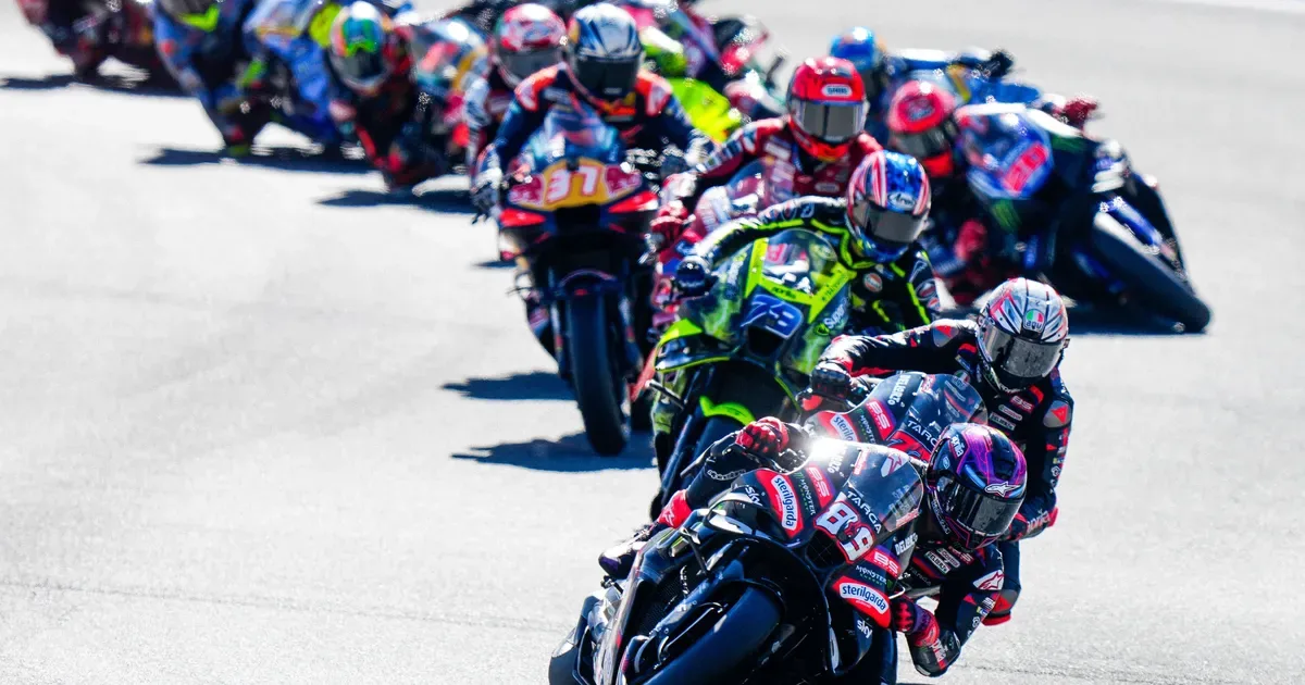 MotoGP paddock and race-event scene representing the championship's global commercial operations.