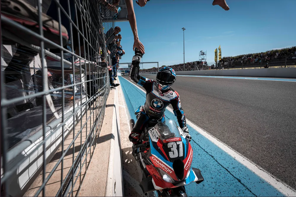 BMW Motorrad World Endurance Team celebrating the 2026 FIM EWC title after the Bol d'Or at Circuit Paul Ricard.
