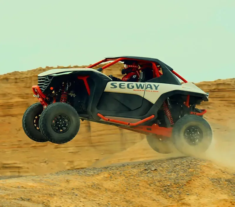 Segway Super Villain side-by-side jumping on a desert off-road course