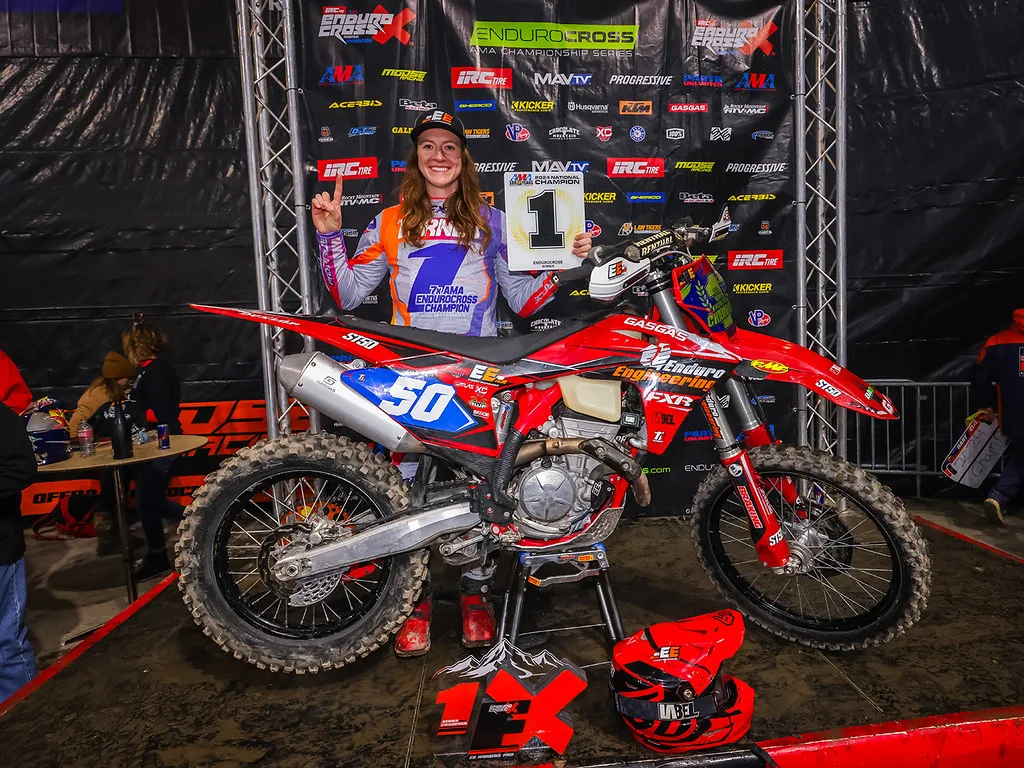 Canadian rider Shelby Turner with her motorcycle after an AMA EnduroCross championship victory