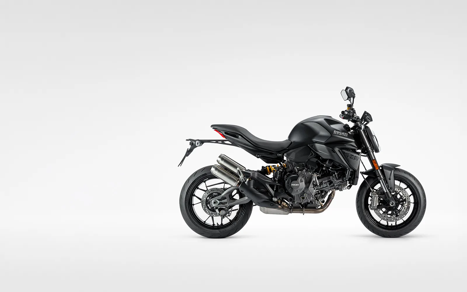 Black 2027 Ducati Monster Dark shown in a three-quarter studio view on a light background