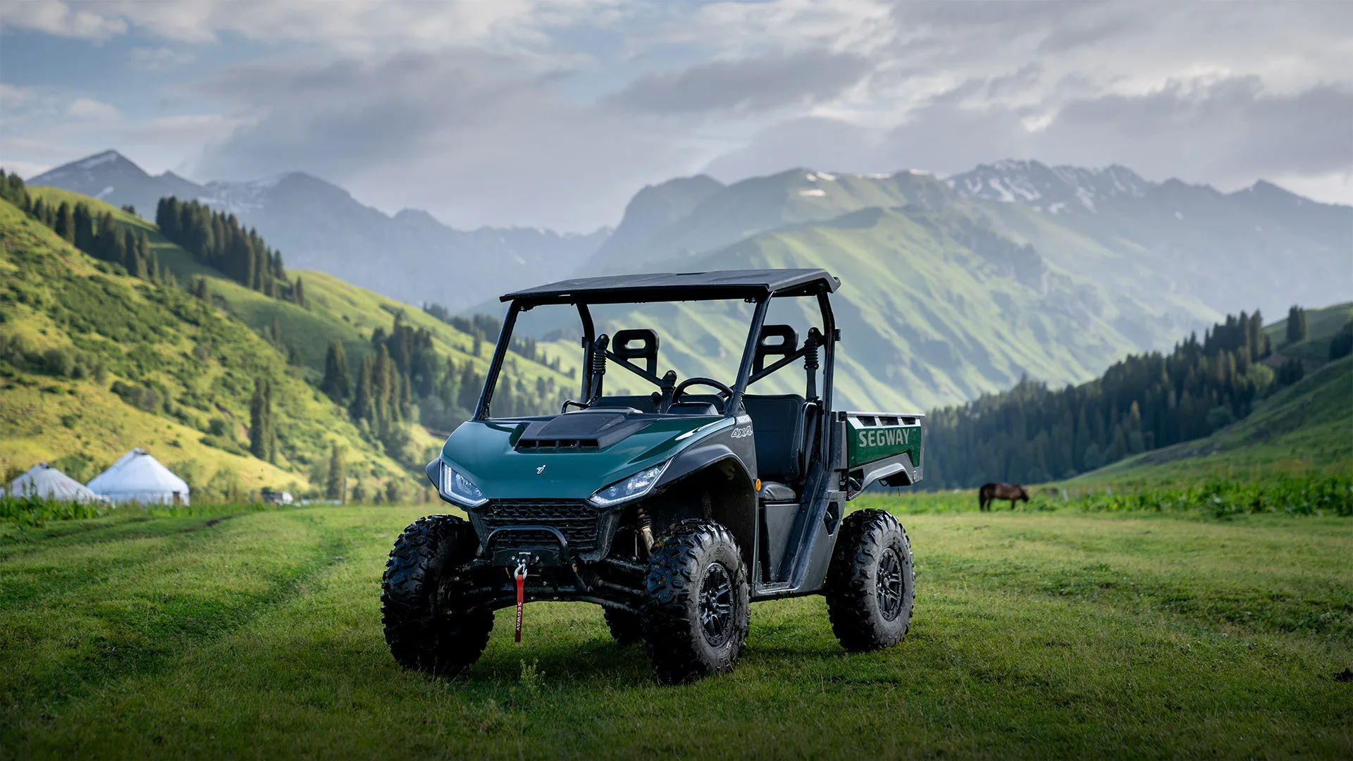 Segway UT6 utility side-by-side in a grassy mountain landscape in a manufacturer product image.