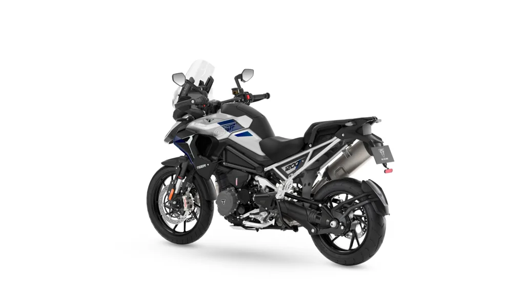 Aluminium Silver and blue 2027 Triumph Tiger 1200 GT Pro, viewed from the left rear.