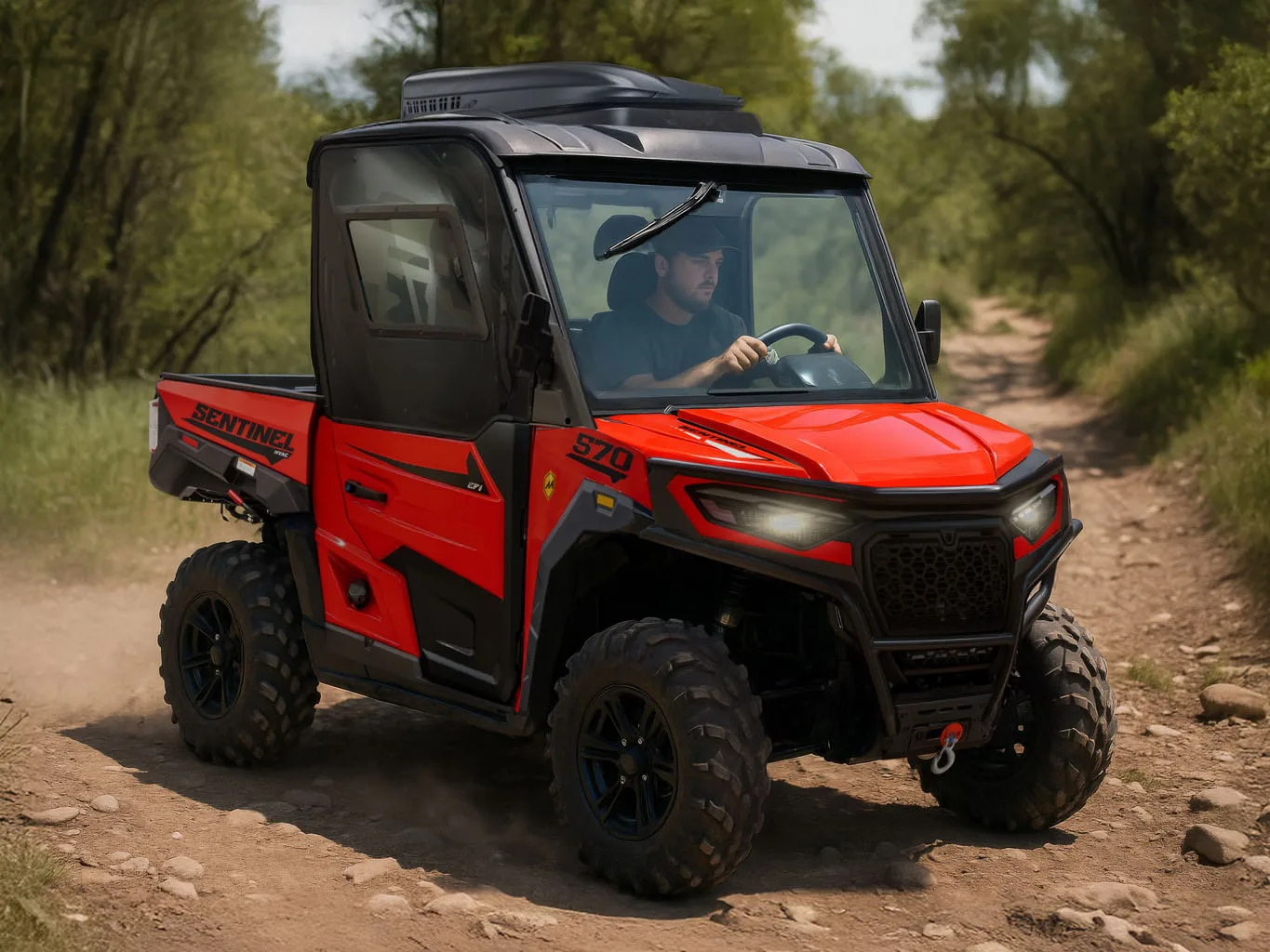 Massimo Sentinel 570 driving on a dirt trail, used as contextual imagery for Massimo’s 570-class utility lineup