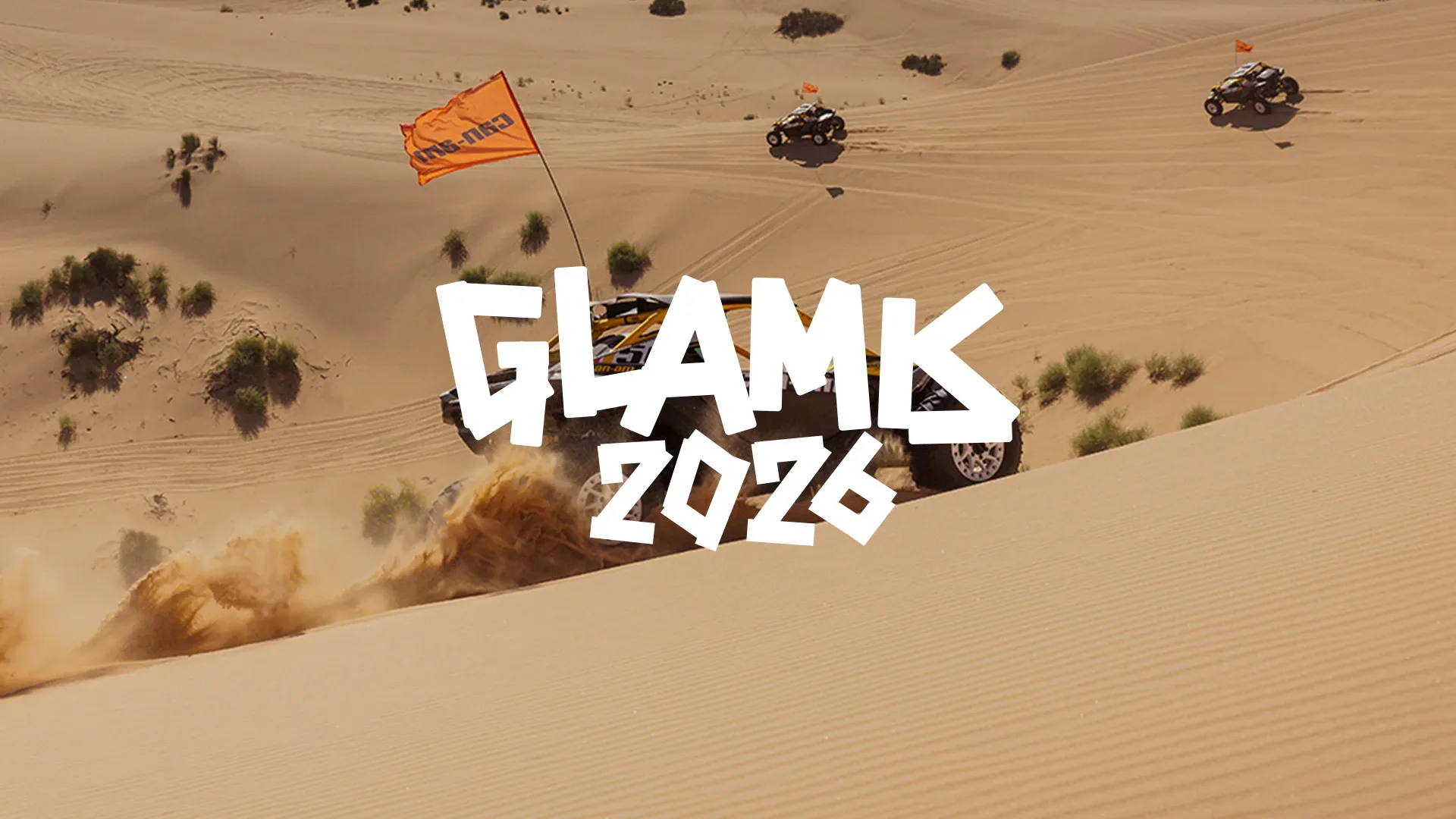 Can-Am Maverick vehicles in sand dunes with Glamis 2026 event lettering.