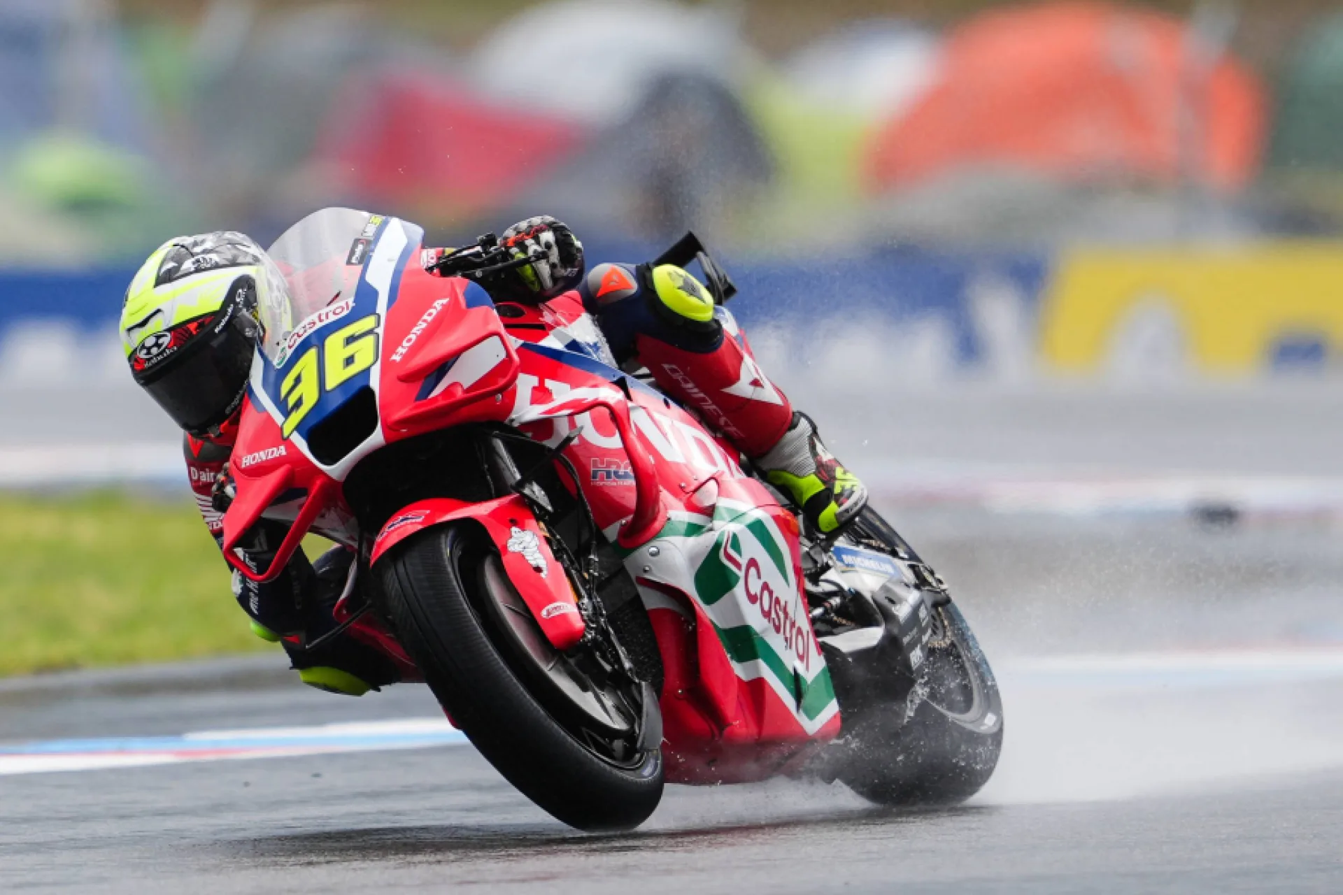 Joan Mir riding the Honda HRC Castrol MotoGP motorcycle in wet conditions at Brno