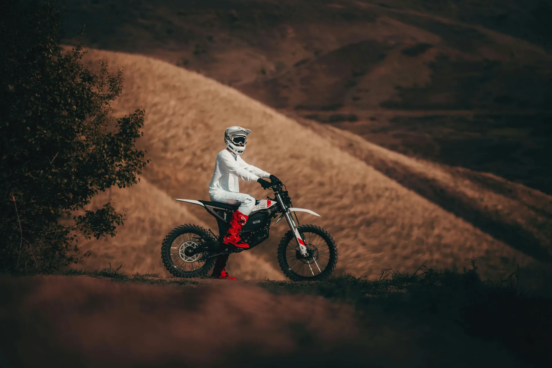 Zero XE electric off-road motorcycle and rider on dirt terrain