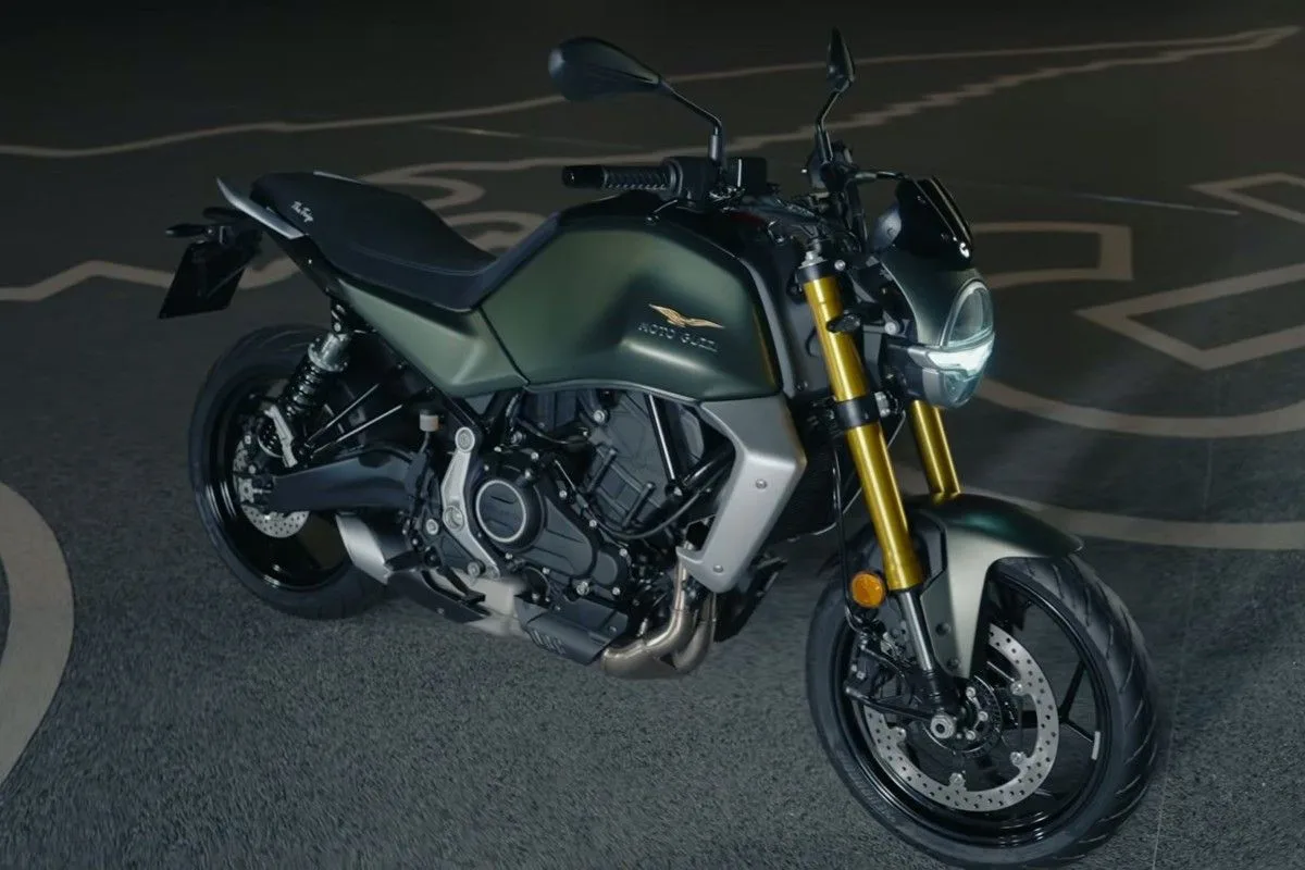 High front three-quarter view of the green Moto Guzzi The Trip roadster.