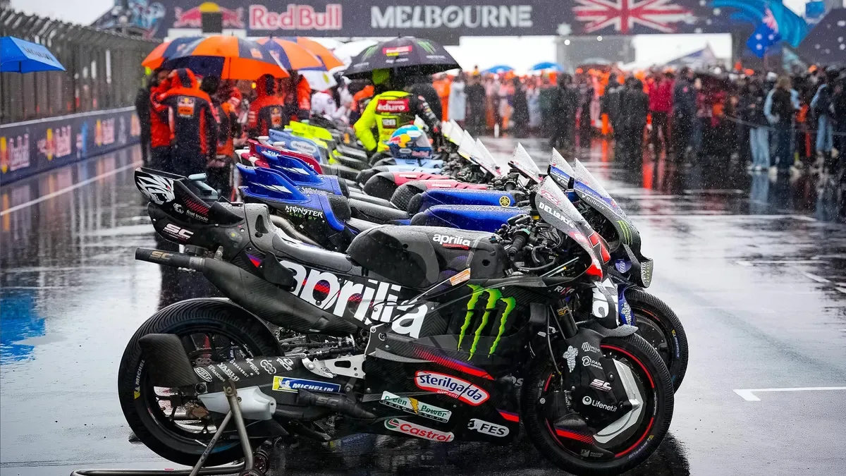 MotoGP riders and motorcycles gather on the wet Phillip Island pit lane for the farewell parade.