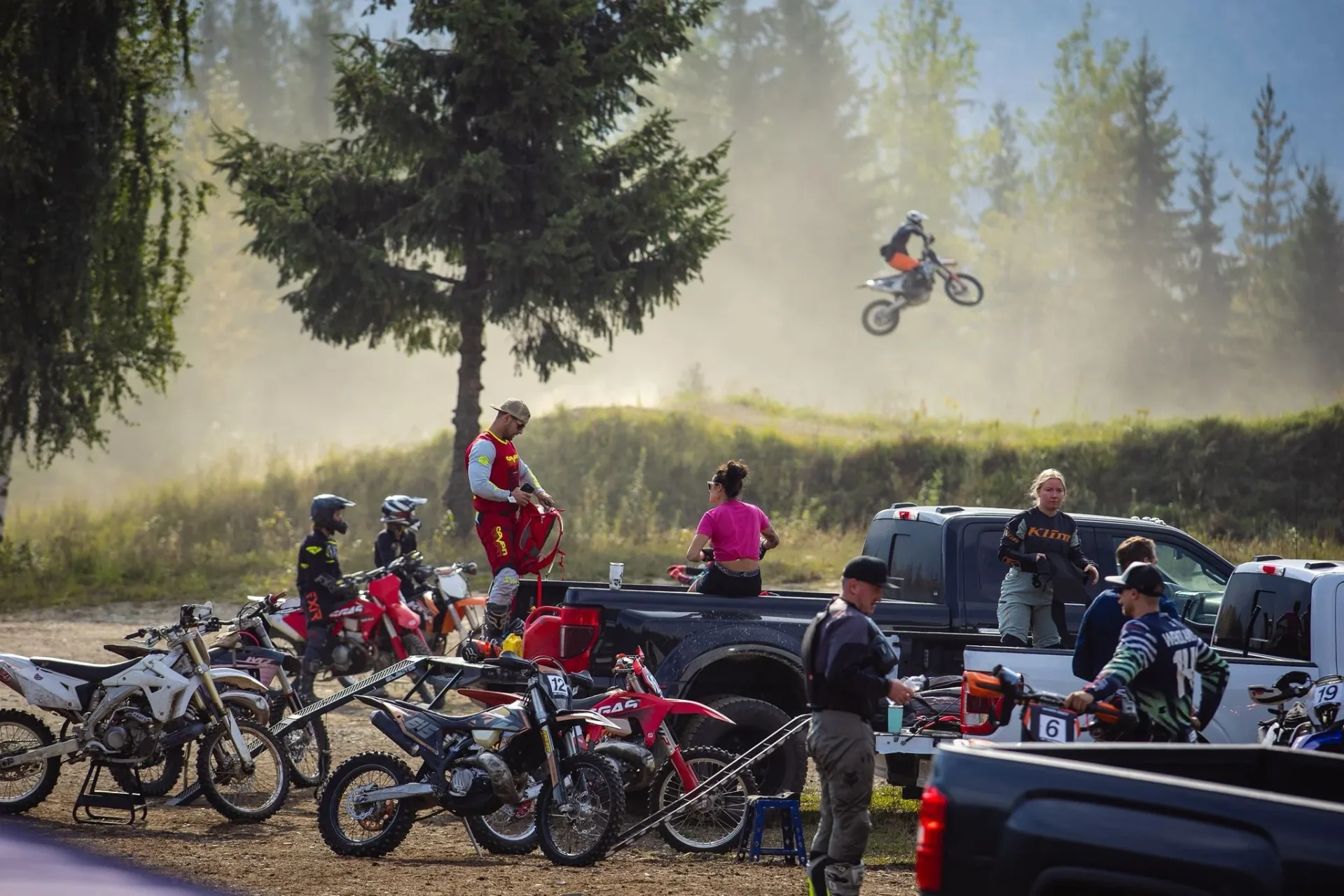 Riders and motorcycles in the Revy Riders staging area at Revelstoke